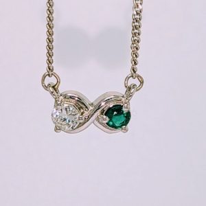 Platinum diamond and emerald Infinity necklace